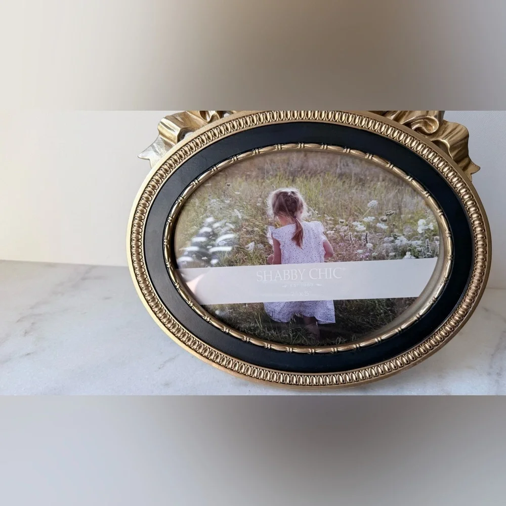 Ornate Oval Gold Photo Frame with Black Trim bow on top 7”x5”